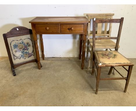 A church chair and another also with a pine desk and a tapestry fire screen. 