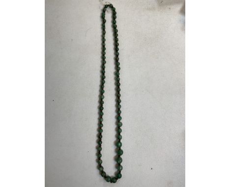 A String of  graduated jade style beads. 