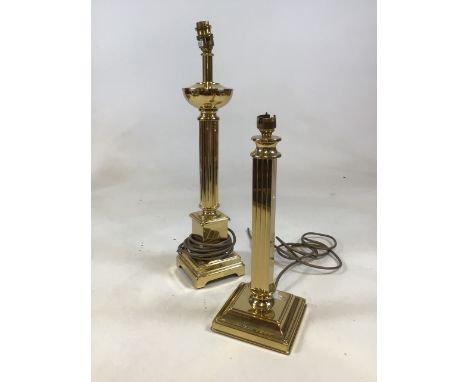 A pair of brass style lamp bases. Tallest is 52cm 