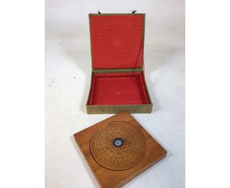 A Chinese compass in material case. W:17.5cm x D:17.5cm x