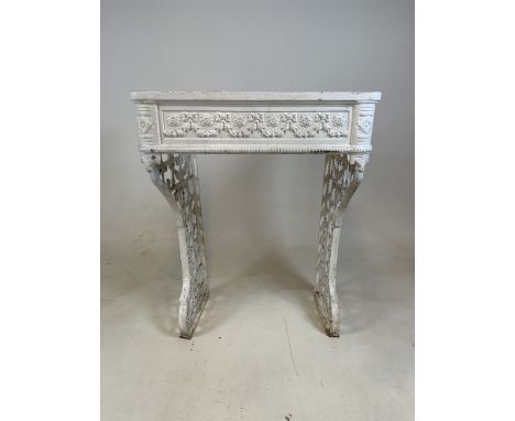 A Victorian cast iron console stand with original white paint decorated with floral swags and flowers. W:59cm x D:44cm x H:76