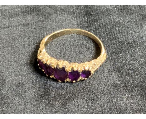 9ct yellow gold and amethyst dress ring, traditional inline layout with five graduated oval faceted amethysts. Hall marks wor