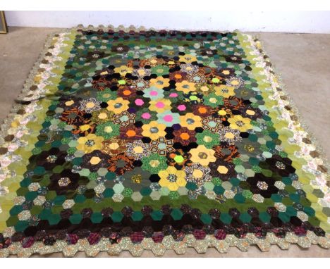 A vintage handmade patchwork quilt. Approx dimensions 198cmx 220cm