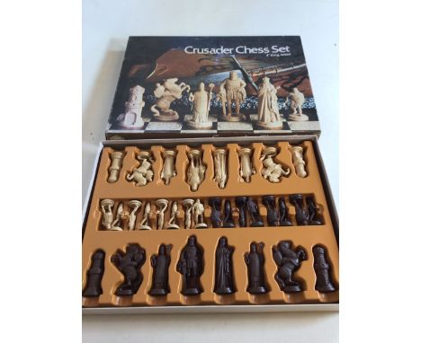 A vintage Crusader chess set - complete. 4 inch king - felted bases. Copyright dated 1974W:41cm x H:41cm Board size 