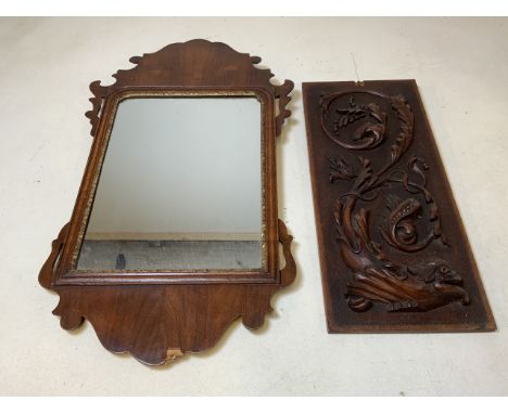 A fret carved wall mirror with gilt inlay also with a carved panel.W:36cm x H:64cm.                           Panel W:20cm x 