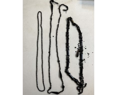 Two jet necklaces and a vintage plastic necklace. (A.F)