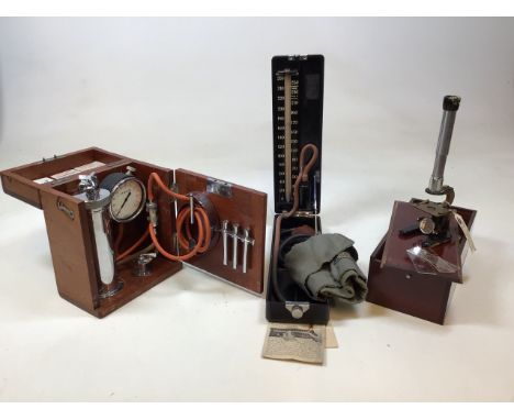 Medical interest. Three vintage medical items. A Cased medical microscope by Gowlands Ltd, an Accson Dominion Sphygmomanomete