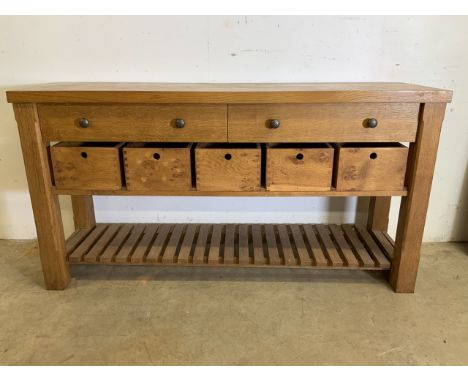 A good quality modern solid oak sideboard with two large drawers, five pull out storage boxes and slatted shelf to base. W:15