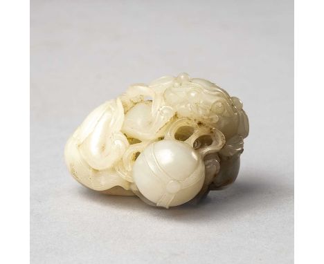 A CHINESE WHITE JADE CARVING OF A BUDDHIST LIONQING DYNASTY4.8cm.The beast depicted playing with a ball between his paws, wit