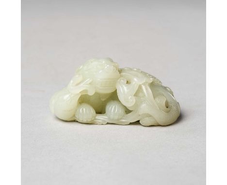 A CHINESE PALE CELADON JADE CARVING OF A MYTHICAL BEAST AND BIRDQING DYNASTY7.7cm.By repute purchased from Robert Kleiner bet
