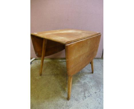 An Ercol Blonde elm and beech drop-leaf table 