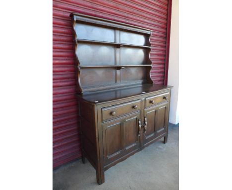An Ercol dark elm and beech dresser 