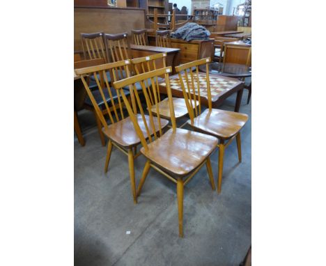 A set of four Ercol Blonde elm and beech 391 model chairs 