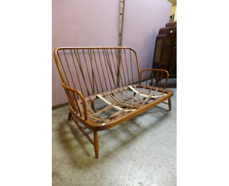 An Ercol Golden Dawn elm and beech settee 