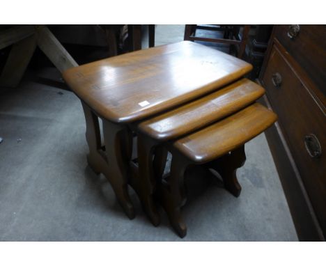 An Ercol Golden Dawn elm nest of tables 