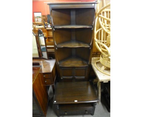 An Ercol dark oak freestanding corner cabinet and TV stand 