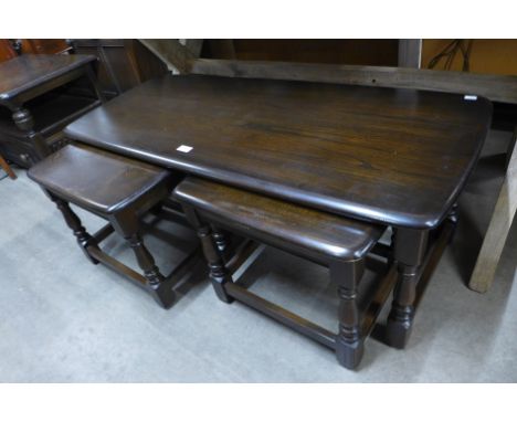 An Ercol dark elm nest of tables 