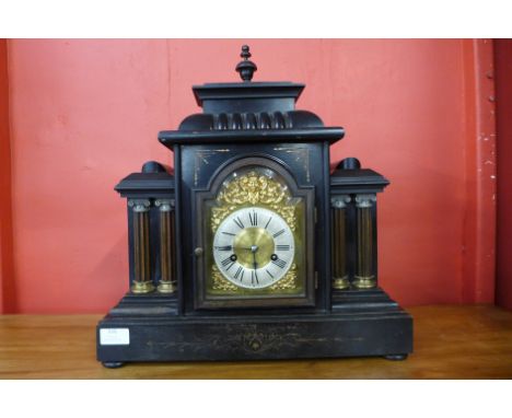A 19th Century German ebonised architectural cased mantel clock, 47cms h 