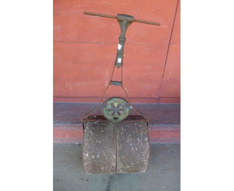A cast iron garden roller 