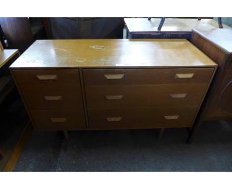 A light oak chest of drawers 