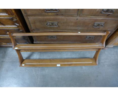 An Ercol Blonde elm and beech plate rack 