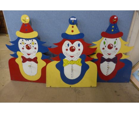 Three vintage painted fairground hoopla clowns 