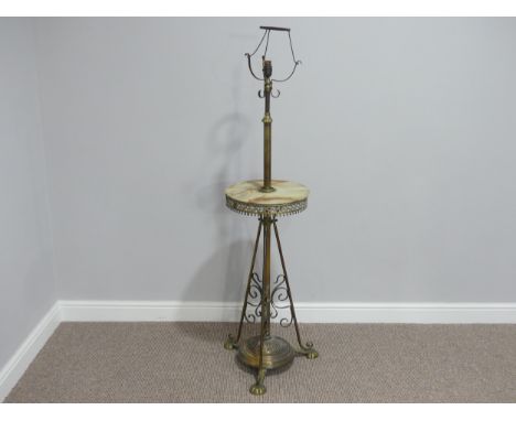 An early 20thC telescopic brass Standard Lamp, with circular onyx centre, 32¾in (83cm) to onyx. 