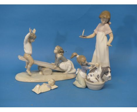 A Lladro 1255 Group on a Seesaw,&nbsp;together with a Lladro figure depicting a Dog Bath, a Nao figure of a Lady holding a Ch