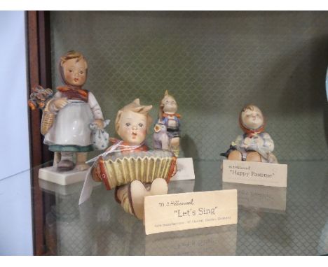 A small quantity of Hummel Figures;&nbsp;comprising 'Happy Pastime', 'Lets Sing', 'Little Hiker' and one other, three with ce