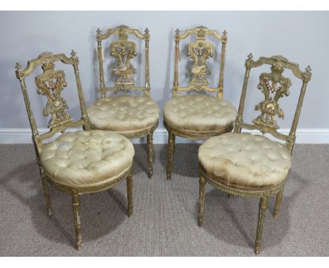 A set of four late 19th century French giltwood parlour Chairs, the frames probably beechwood, the backs carved and pierced d