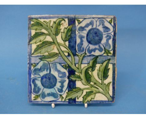 A William de Morgan 'Rose Trellis' pattern Tile, the tile decorated with rose and trellis, in greens and blue on a cream grou