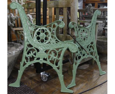 A pair of Victorian green-painted cast iron Bench Ends, with central lion mask motif, with supports for wooden slats, 24in (6