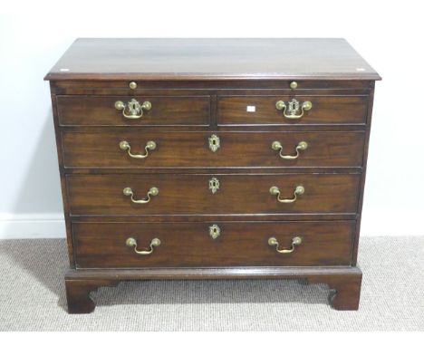 A Georgian mahogany chest of drawers with slide, the rectangular top above brushing slide, two short and three long drawers w