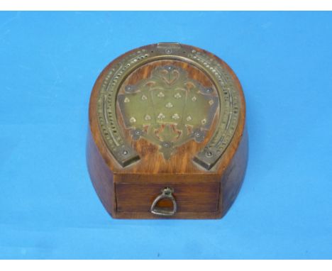 An early 20th century mahogany and brass 'D&amp;A' horseshoe-shaped Cribbage Board, the top with playing cards decoration and