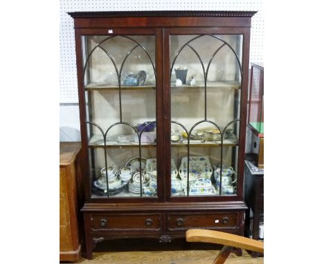 An early 20th century astragal glazed Display Cabinet, in the Georgian style, the dentil cornice above two glazed doors enclo