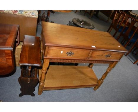 Reproduction oak side table, fitted with two frieze drawers over an open shelf, 96cm and a stained beechwood magazine rack/oc