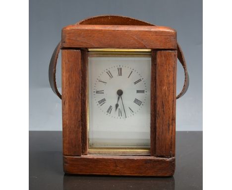 French brass case carriage clock, serpentine outlines, silvered dial, platform escapement, 13cm in a morocco carrying case.