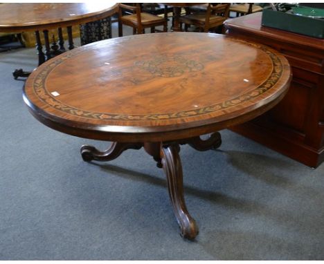 Victorian walnut and marquetry loo table, oval tilt top with quartered veneers, Dutch style floral marquetry decoration, lobe