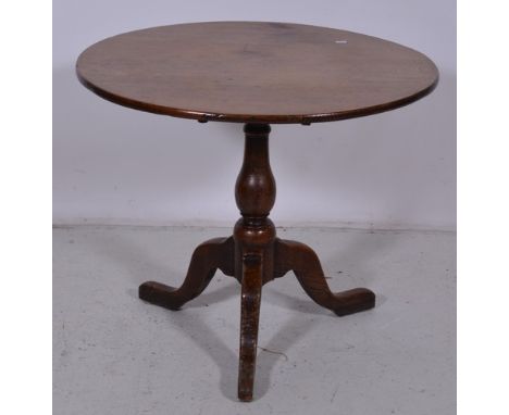 Georgian oak pedestal table, circular tilt top, pear shape column on a tripod legs, diameter 80cm.