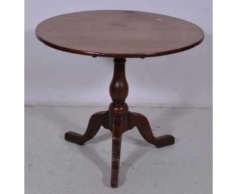 Georgian oak pedestal table, circular tilt top, pear shape column on a tripod legs, diameter 80cm.