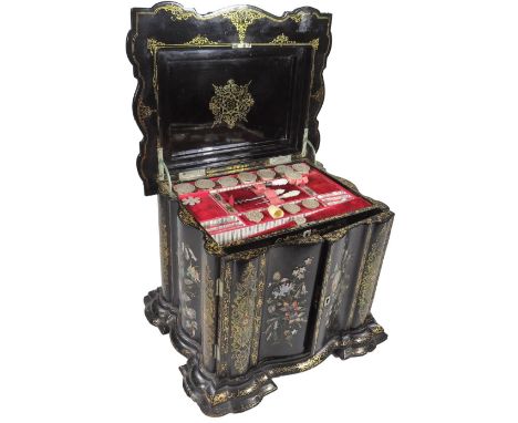 A 19thC papier mache table sewing cabinet, profusely decorated with gilt highlighted mother of pearl flowers to all sides, th