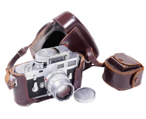 A Leica Ernst Leitz camera, with GMB H Wetzlar Summicron F=5cm 1:2 lens, a light meter brown leather case, 16cm W, and a furt