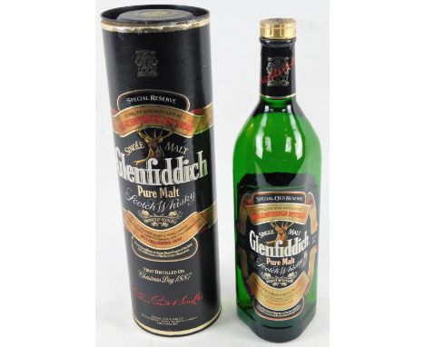 A bottle of Glenfiddich Single Malt Scotch Whisky, 1 litre bottle, in card tube.
