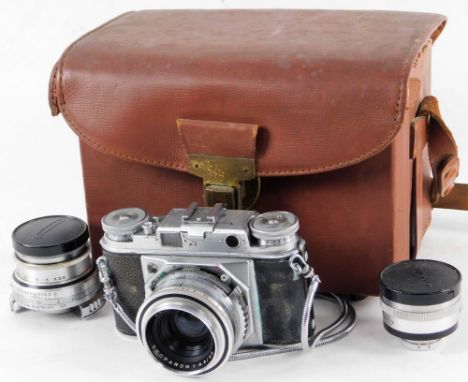 A cased camera set, Voigtlander camera, in fitted case, 24cm W, with Skoparon 1:3.5/35 lens, lens cap and other accessories. 