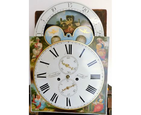 Greenhalgh of Manchester. A Victorian longcase mahogany clock, with a shaped crest and arched hood, flanked by spirally hinge