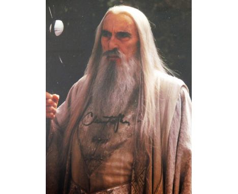 A Lord Of The Rings related photographic print, signed Christopher Lee, mounted and framed, 31cm x 25cm.
