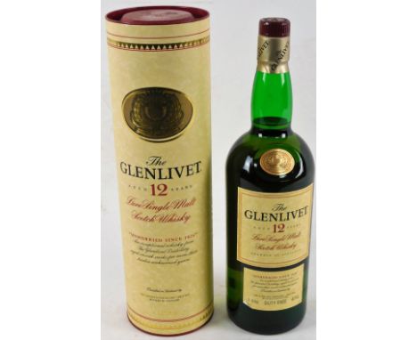 A bottle of Glenlivet 12 Year Old Single Malt Scotch Whisky, 1 litre bottle, in card tube.