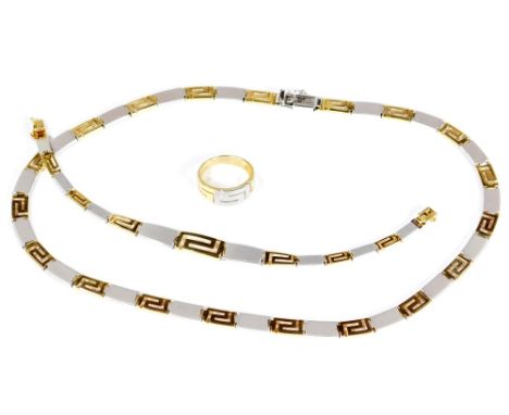 An Aztec design bi-colour jewellery set, comprising necklace, bracelet and ring, with brushed white metal and yellow metal az
