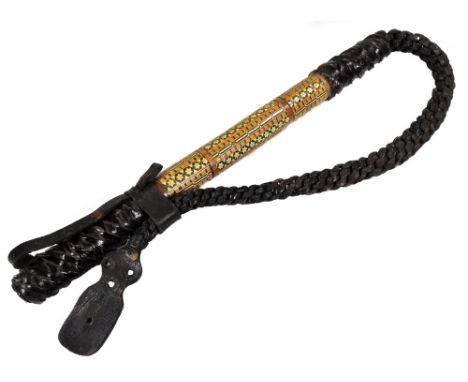 A 19thC Anglo Indian whip, with turned leather end, shaped handle and parquetry inlaid centre section, decorated with a repea