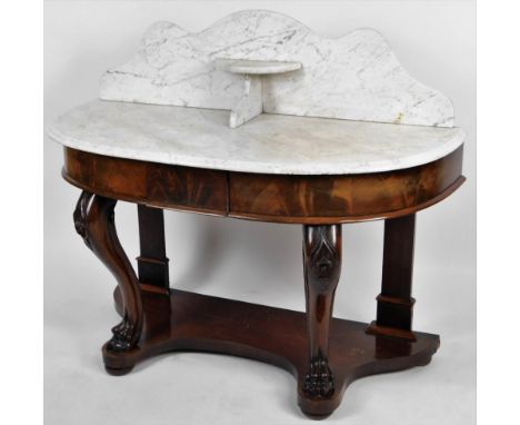 A Victorian mahogany duchess dressing table, the D-end top with a curved pediment with D-end shelf, raised on front inverted 